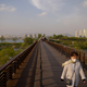 A woman walks along a bridge near the Yeouido district of Seoul, South Korea.